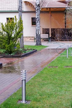 Automatic watering on a green lawn in the yard