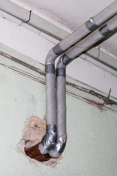 Water gray pipe in the room close up