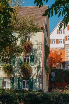 Old national German town house. Old Town is full of colorful and well preserved buildings. Baden-Wurttemberg is a state in southwest Germany bordering France and Switzerland. The Black Forest, known for its evergreen scenery and traditional villages, lies in the mountainous southwest. Stuttgart, the capital, is home to Wilhelma, a royal estate turned zoo and gardens. Porsche and Mercedes-Benz have headquarters and museums there. The 19th-century Hohenzollern Castle sits in the Swabian Alps to the south.