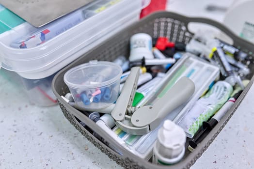 Close-up of dentist doctor work table with special professional tools. Technology, medicine, care and dental health.