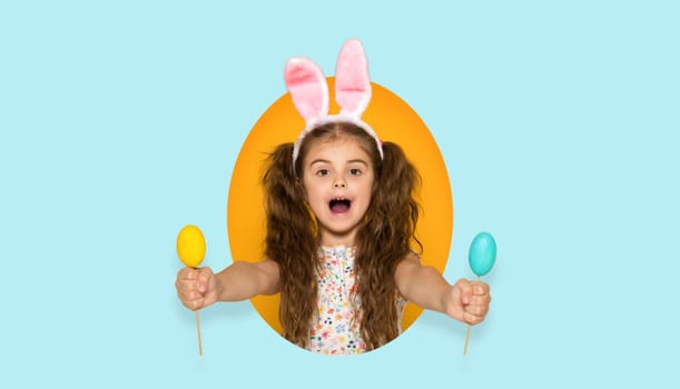 very excited surprised little child girl with Easter bunny ears holding yellow and blue eggs . Happy easter