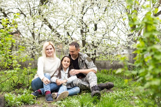 Handsome soldier reunited with family on a sunny day