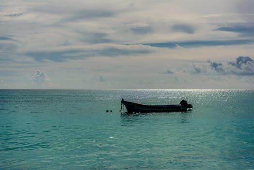 The boat in the Caribbean Sea on a sunny day. Clear water.