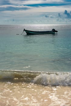 The boat in the Caribbean Sea on a sunny day. Clear water.