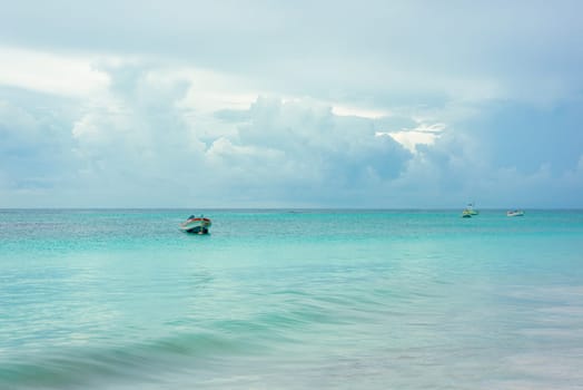 The boat in the Caribbean Sea on a sunny day. Clear water.