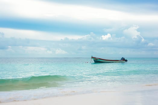 The boat in the Caribbean Sea on a sunny day. Clear water.