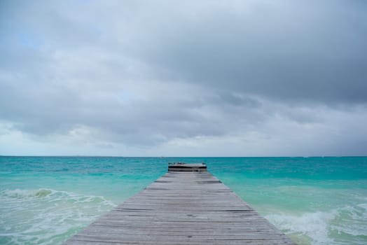 Seagull on a pier overlooking the Caribbean Sea. Mexico.