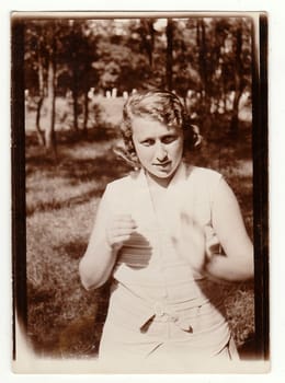 THE CZECHOSLOVAK REPUBLIC, APRIL 15: Vintage photo of a young girl in nature, April 15, 1931.