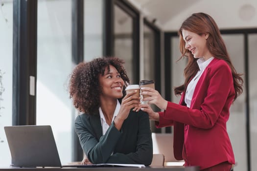 Multiethnic business people meeting and communicating at coffee break. Tax, exchange, accounting and financial advisor.