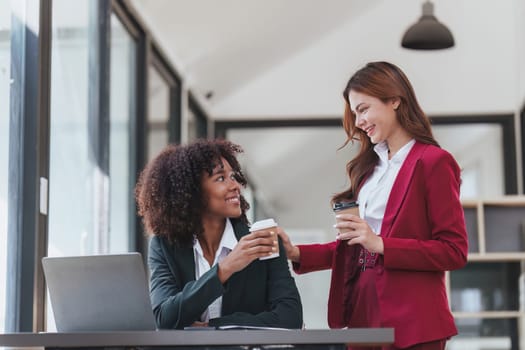 Multiethnic business people meeting and communicating at coffee break. Tax, exchange, accounting and financial advisor.