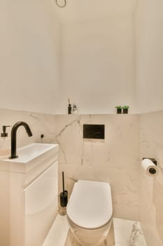 a bathroom with white walls and marble flooring, including a toilet in the fore - image is taken from above