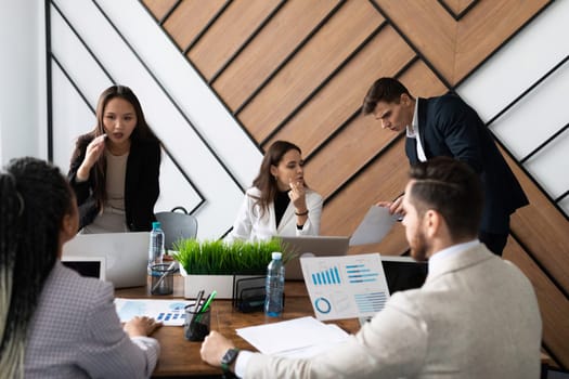 startup accountants discuss company affairs at a round table.