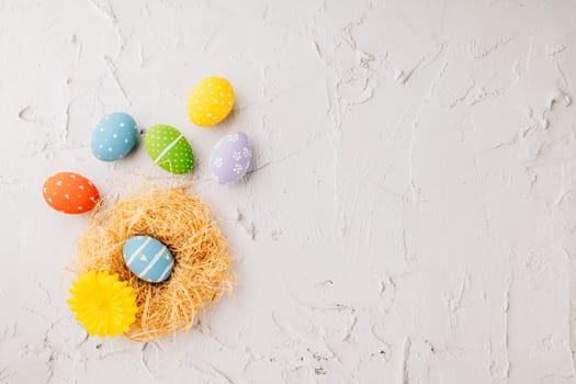 Top view holiday banner background web design white easter eggs in brown nest on white cement background with empty copy space, celebration greeting card, overhead, template, Happy Easter Day Concept