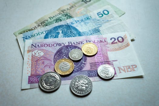 Polish coins and banknotes on the counter, top view