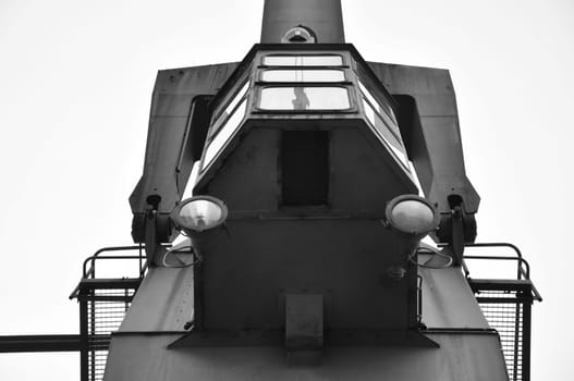 Low-angle grayscale shot of an old cargo crane in the Media Harbor in Dusseldorf, Germany.