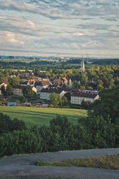 Scenic vertical shot of beautiful colliery houses surrounded with evergreen trees in Ruhr area, Germany