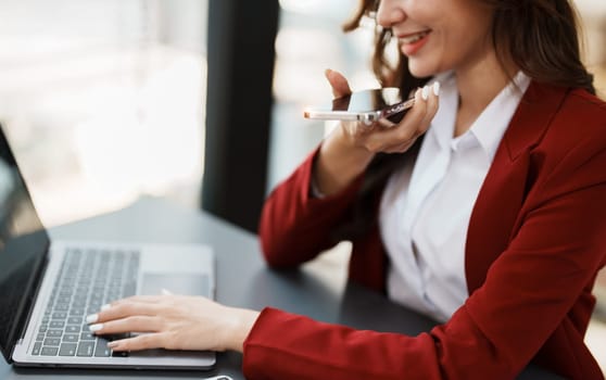 Beautiful young teen asian businesswoman using computer and smartphone mobile with planning working on financial document, tax, exchange, accounting and Financial advisor.