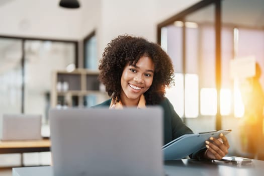 Beautiful young teen American African business women holding computer laptop with hands up in winner is gesture, Happy to be successful celebrating achievement success.