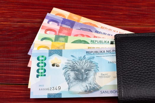 Philippine money - peso in the black wallet