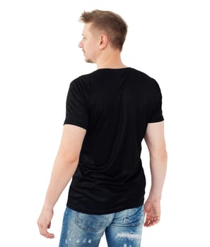Young man in a black T-shirt isolaled on a white background, back view. Blank for your design