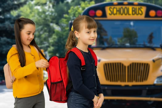 Little kids schoolchildren pupils students, the school bus. Welcome back to school. The new academic semester year start.