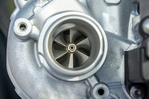 turbine impeller. new turbocharged car engine. A turbine for an automobile engine. Maintenance and repair of the car in the car service