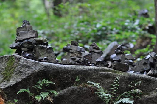 Closeup shot of quarry stones stacked in balance in the Oker valley in the Harz mountains in Germany