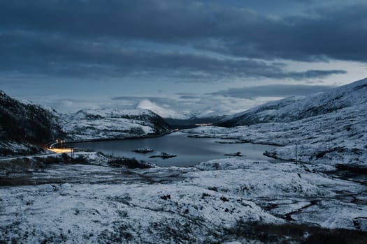 Lake Finnvikvatnet near Tromso in Norway during fall with snow