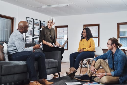 He always thinks out of the box. a group of businesspeople having a meeting and discussing ideas in their office at work