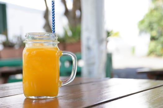 Horizontal shot of a jar of homemade orange juice.