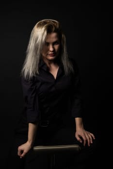 Portrait of beautiful female model on black background