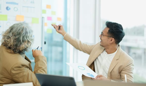 Asian entrepreneurs and business people meeting in a conference room in business planning, financial budget and investment risk assessment to analyze customer groups to increase company growth.