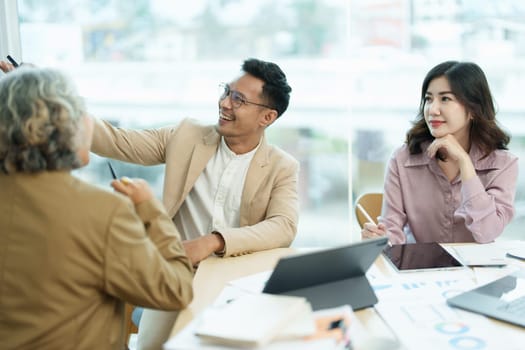 Asian entrepreneurs and business people meeting in a conference room in business planning, financial budget and investment risk assessment to analyze customer groups to increase company growth.