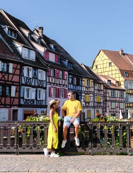 Couple of men and women on a city trip at Colmar France Beautiful view of the colorful romantic city of Colmar in the evening, the Historic town of Colmar, Alsace region, France