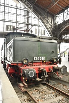 Vertical shot of a historic traditional locomotive at the museum station in Leipzig, Germany