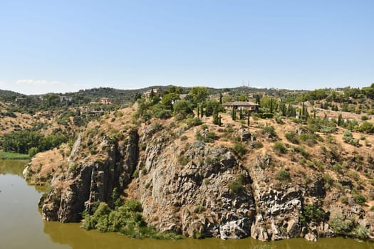 Scenic view of the river and old town of Toledo, Spain on a sunny day