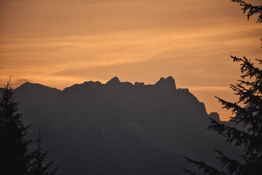 Beautiful landscape of the Leogang Mountains silhouette in Salzburg, Austria, at sunrise
