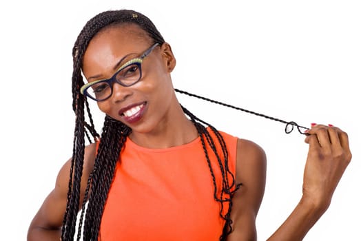 girl standing in glasses looking at camera smiling.