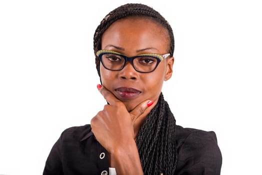 young african woman standing on white background looking at the camera.
