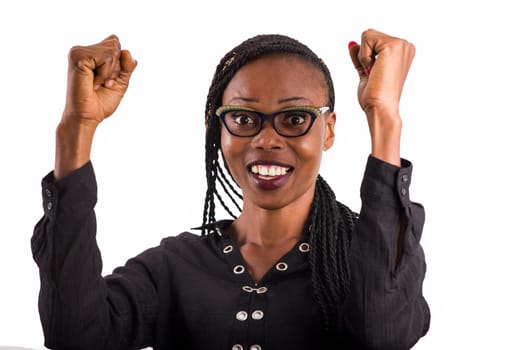 young african woman in glasses isolated on white background looking at camera laughing with trained fists.