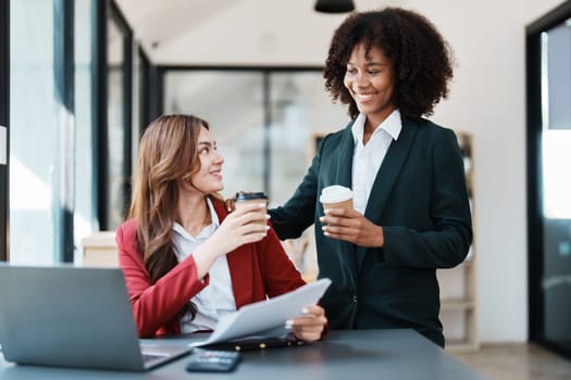 Multiethnic business, Beautiful American African and asian businesswoman people meeting coffee break, Accountant people do document, tax, exchange, accounting, Financial and discussion advisor.