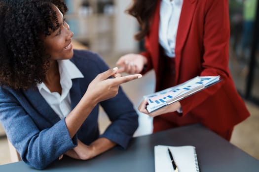 Multiethnic business, Beautiful American African with asian businesswomans people in meeting. Accountant people do document, tax, exchange, accounting and Financial advisor.