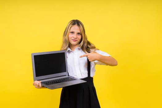 Excited little kid girl 12-13 years old isolated yellow background. Childhood lifestyle concept.