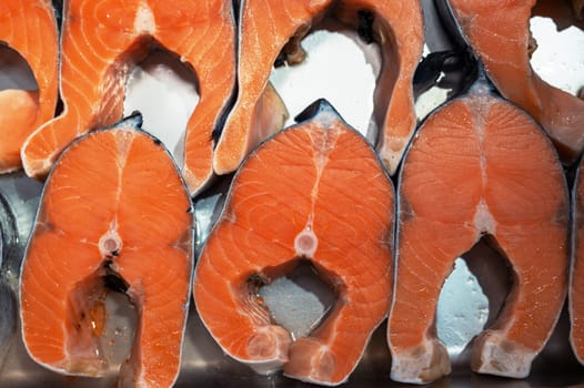 Salmon steaks fish closeup in a market. Healthy eating and fish market concept