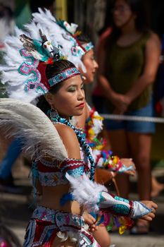 Arica, Chile - January 23, 2016: Tobas dancers in traditional Andean costume performing at the annual Carnaval Andino con la Fuerza del Sol in Arica, Chile.