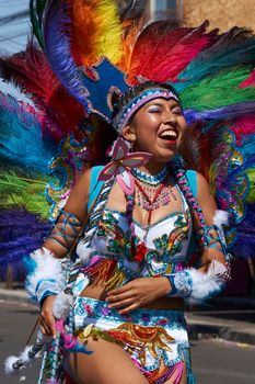 Arica, Chile - January 23, 2016: Tobas dancers in traditional Andean costume performing at the annual Carnaval Andino con la Fuerza del Sol in Arica, Chile.