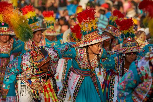 Arica, Chile - January 23, 2016: Tinkus dancing group in colourful costumes performing a traditional ritual dance as part of the Carnaval Andino con la Fuerza del Sol in Arica, Chile.