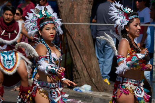 Arica, Chile - January 23, 2016: Tobas dancers in traditional Andean costume performing at the annual Carnaval Andino con la Fuerza del Sol in Arica, Chile.