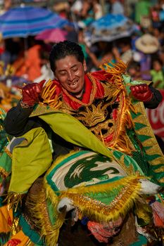 Arica, Chile - January 23, 2016: Members of a Waca Waca dance group in ornate costume performing at the annual Carnaval Andino con la Fuerza del Sol in Arica, Chile.