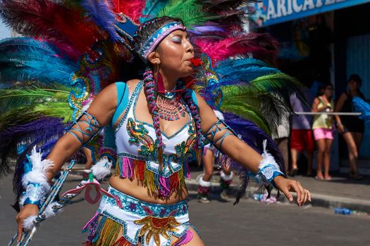 Arica, Chile - January 23, 2016: Tobas dancers in traditional Andean costume performing at the annual Carnaval Andino con la Fuerza del Sol in Arica, Chile.